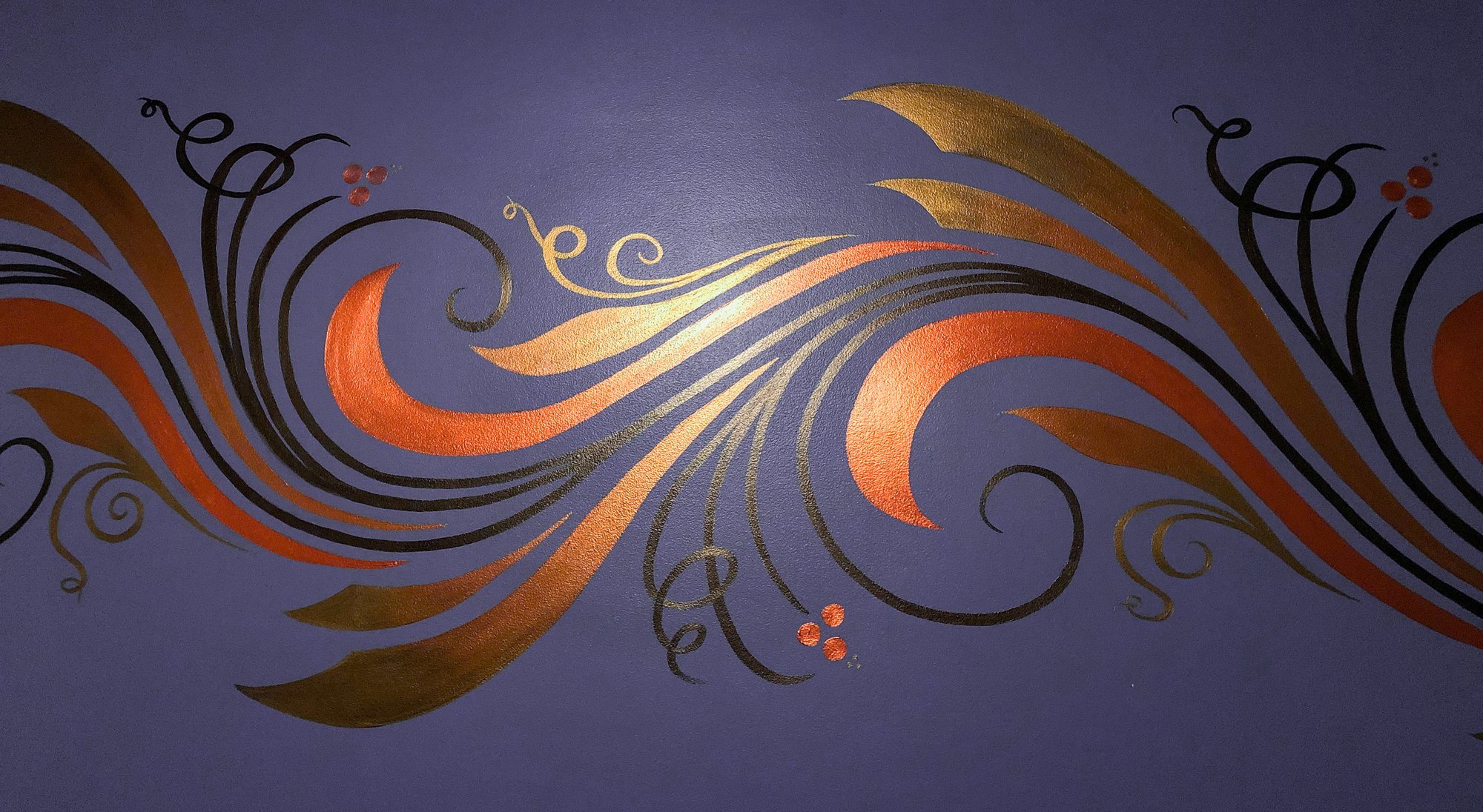Copper, gold, and black feather-scroll mural sweeping across a deep purple wall.