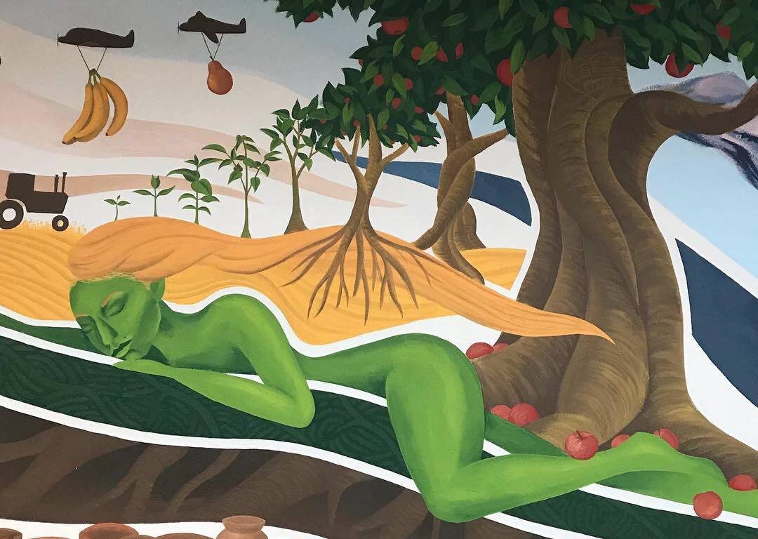 Section of the Pachamama mural showing layered natural imagery.