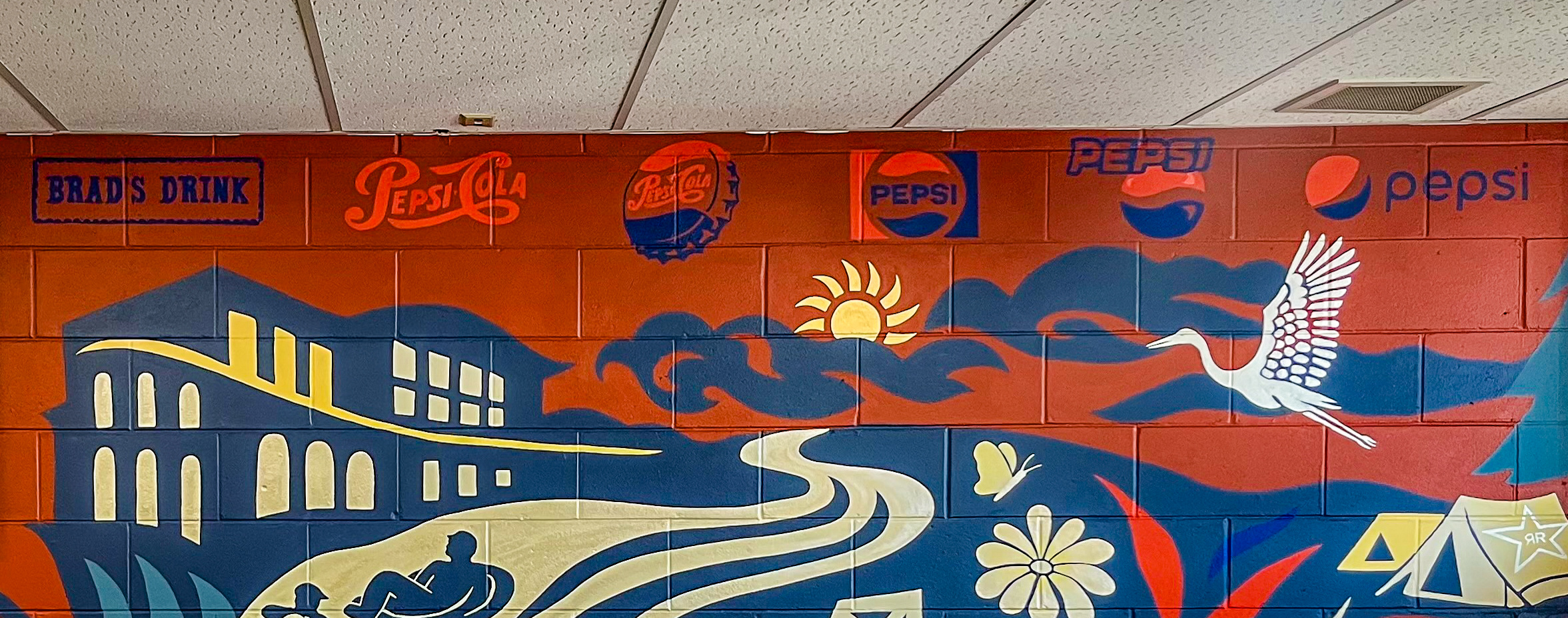 Mural section painted on a PepsiCo facility wall.