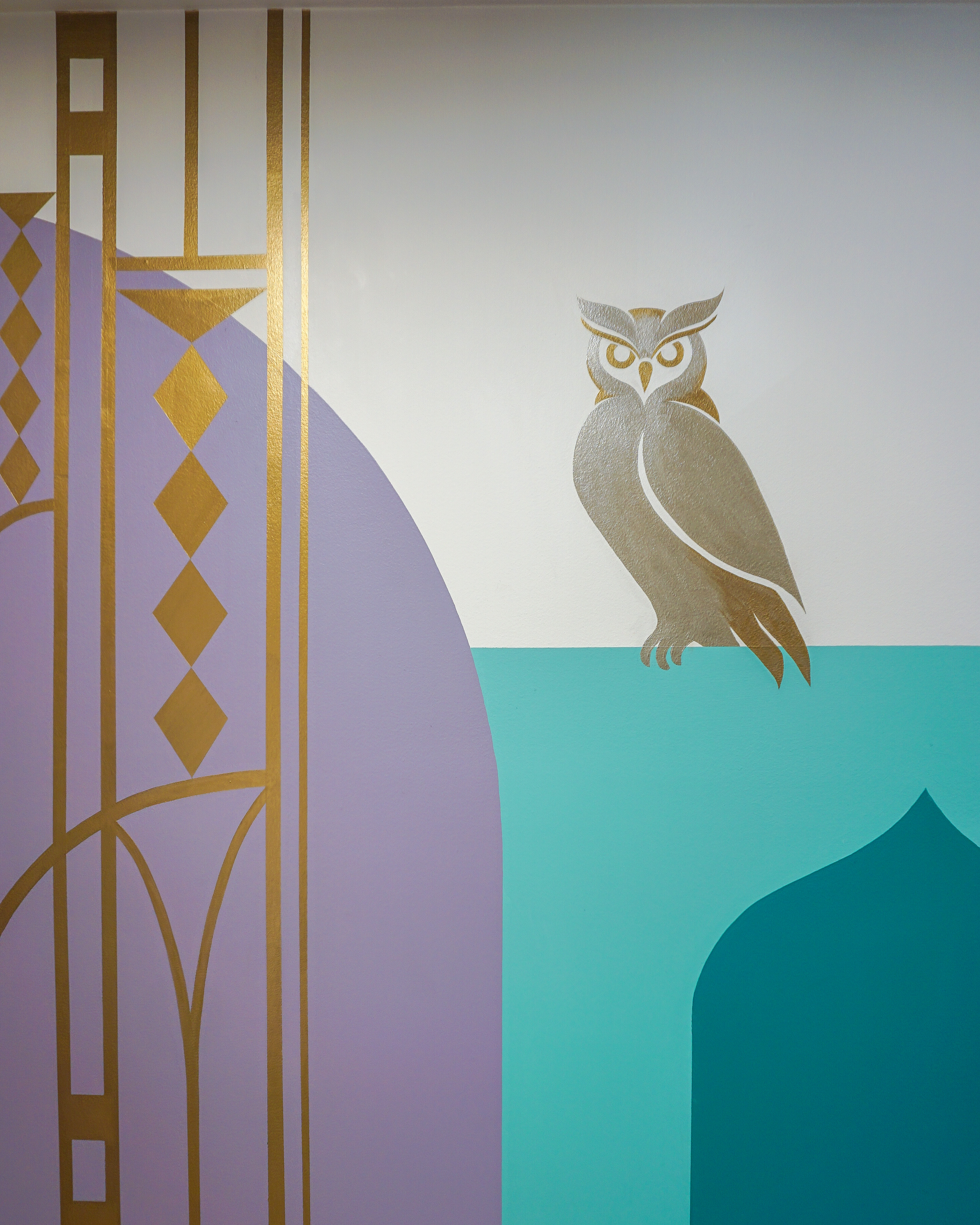Interior mural at The Grand Apartments with geometric blocks.